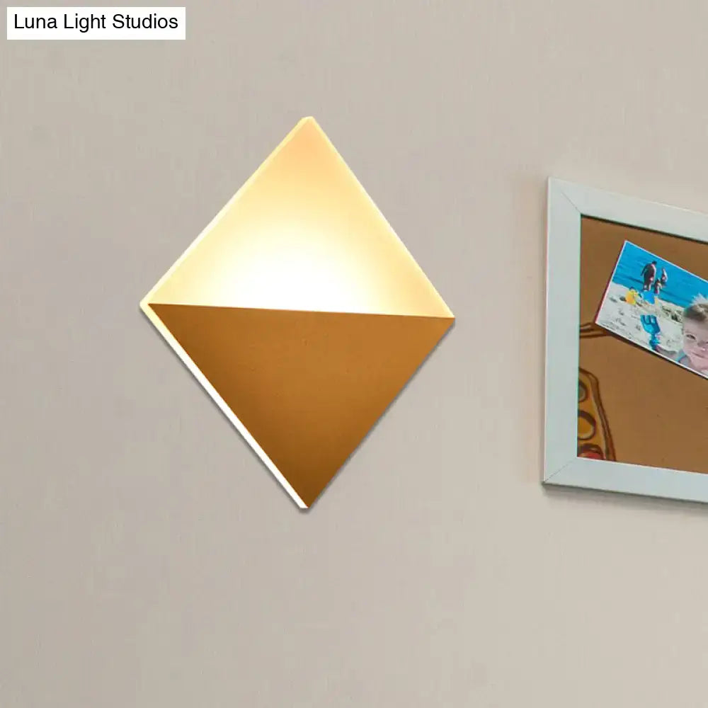 Gold black square sconce, diamond-shaped wall light with warm glow, Decorbites on Tampa Home & Garden Store