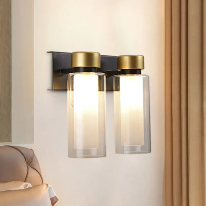 Decorbites gold black dual cylinder wall lamp with two clear glass shades and brass caps on Tampa Home & Garden Store