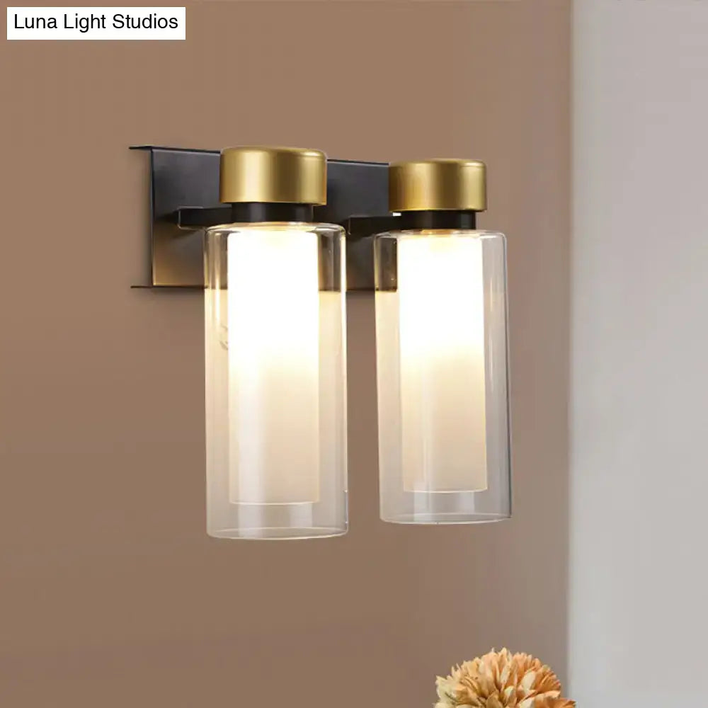 Gold Black Dual Cylinder Lamp wall-mounted, clear glass shades, warm glow by Decorbites on Tampa Home & Garden Store