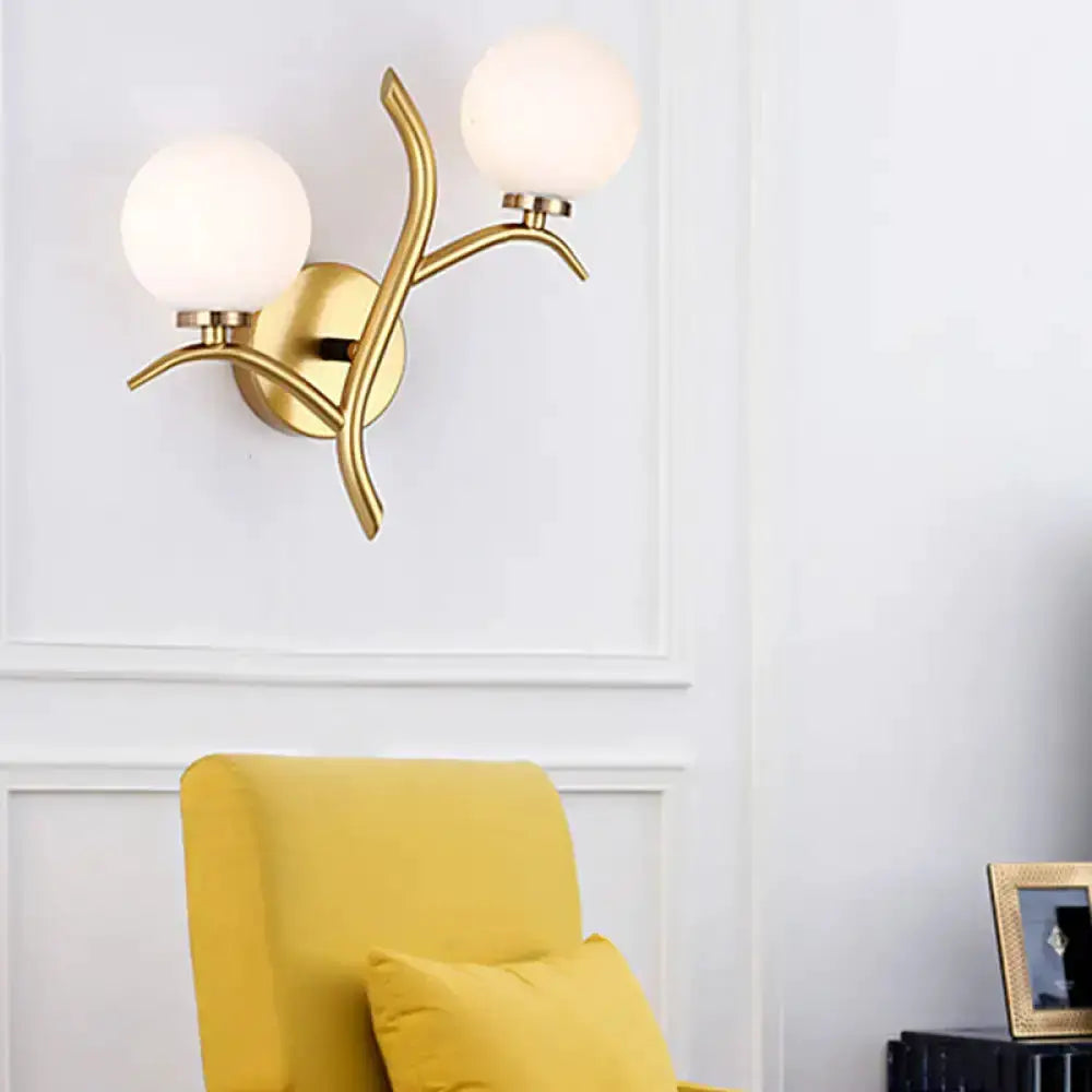 Modern gold branch living room sconce with two glass globes brass finish on Tampa Home & Garden Store
