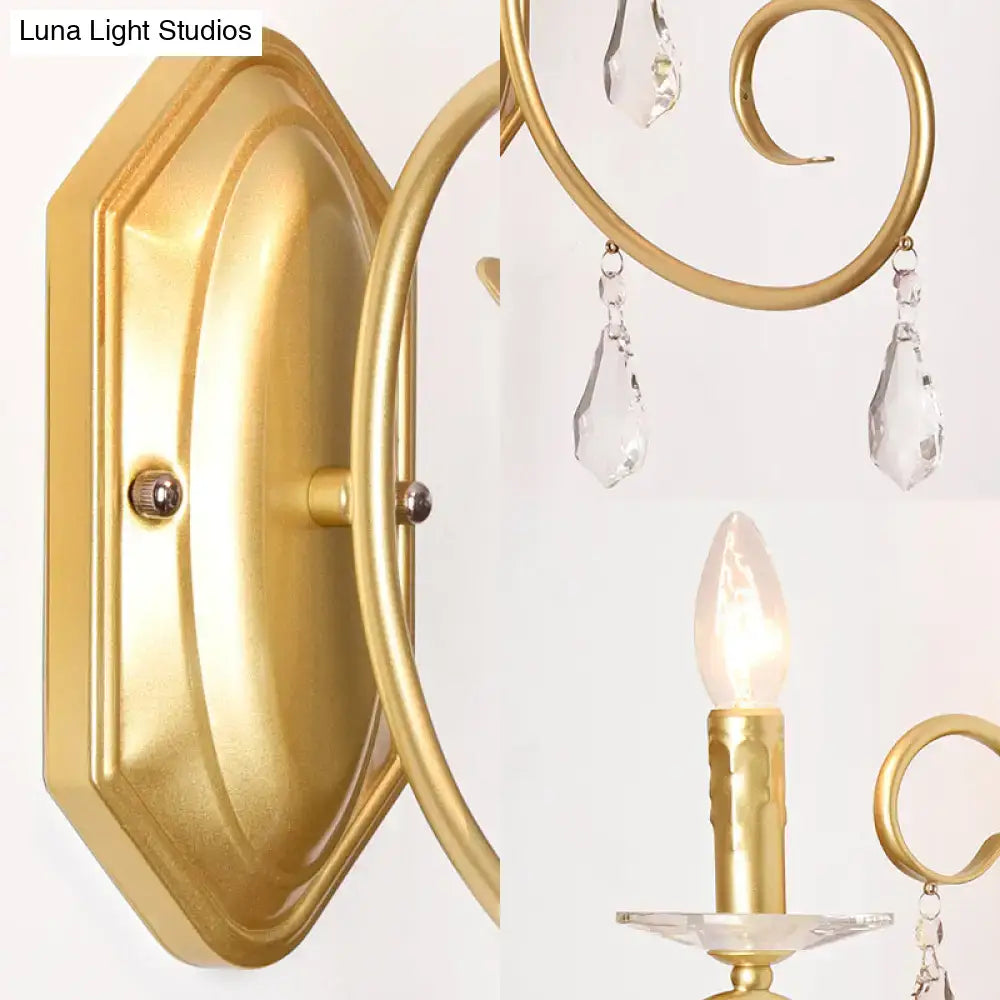 Gold crystal wall sconce with brass finish and hanging crystals for hallway decor on Tampa Home & Garden Store