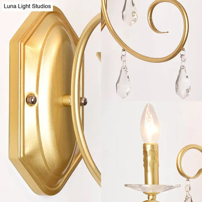 Gold crystal wall sconce with brass finish and hanging crystals for hallway decor on Tampa Home & Garden Store