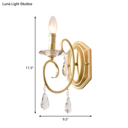 Gold crystal wall sconce for corridor hallway with candle-style bulb and hanging prisms on Tampa Home & Garden Store