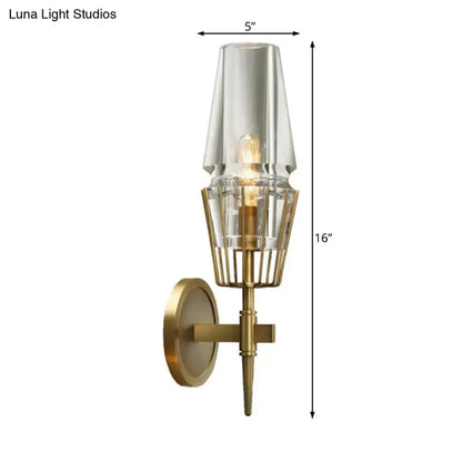 Modern gold clear glass wall lamp by Decorbites with a geometric brass cage for bedroom on Tampa Home & Garden Store