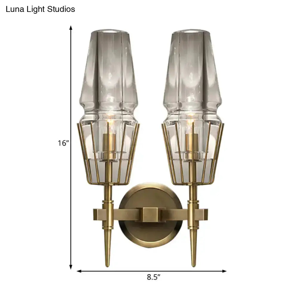 Modern gold clear glass wall lamp pair by Decorbites with geometric brass cages for bedroom on Tampa Home & Garden Store