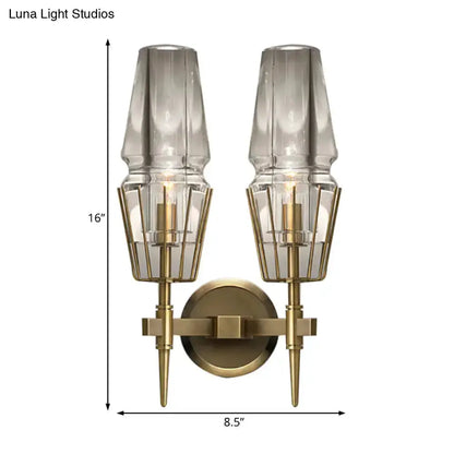 Modern gold clear glass wall lamp pair by Decorbites with geometric brass cages for bedroom on Tampa Home & Garden Store
