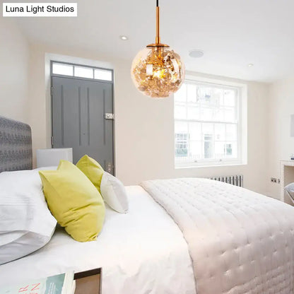 Gold glass orb wall light pendant by Decorbites with gold finish in a bright bedroom on Tampa Home & Garden Store