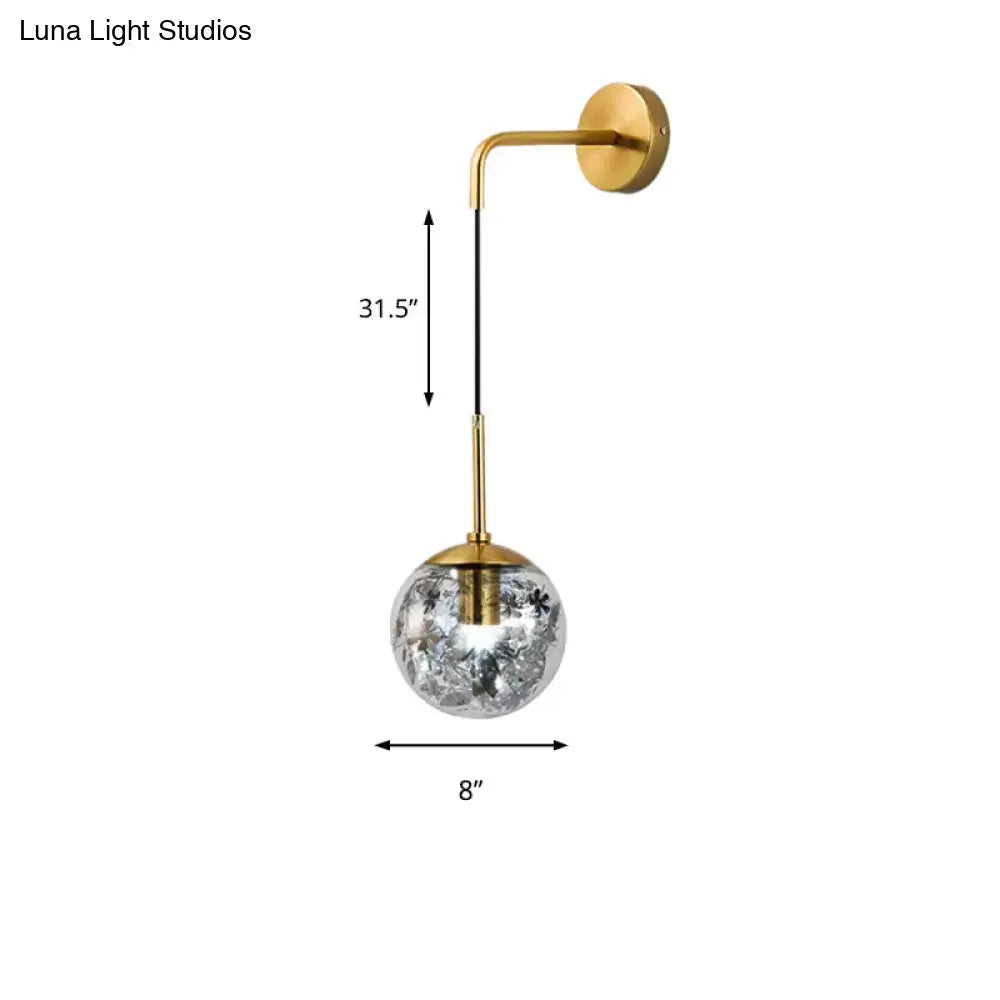 Gold glass orb wall light sconce by Decorbites with brass finish and crystal globe on Tampa Home & Garden Store