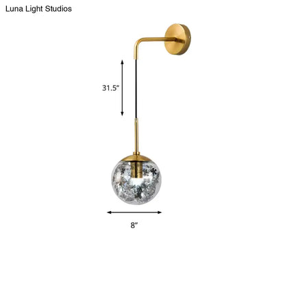 Gold glass orb wall light sconce by Decorbites with brass finish and crystal globe on Tampa Home & Garden Store