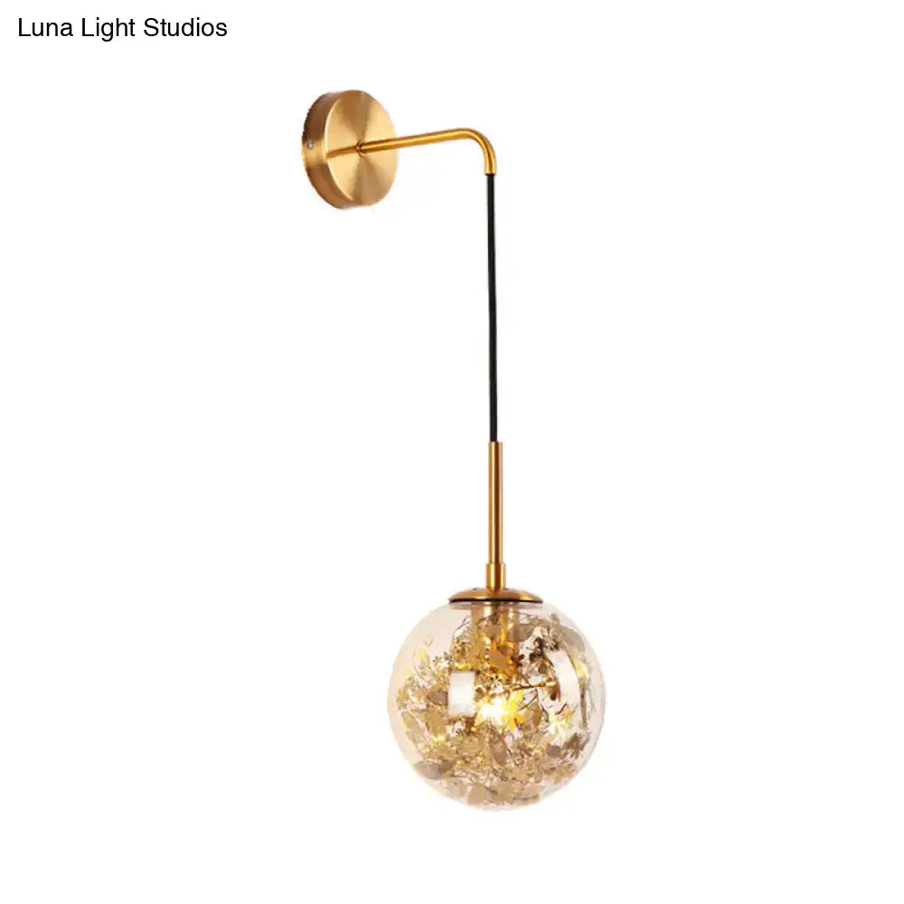 Gold Glass Orb Wall Light by Decorbites; brass arm, black stem, orb with gold flakes on Tampa Home & Garden Store