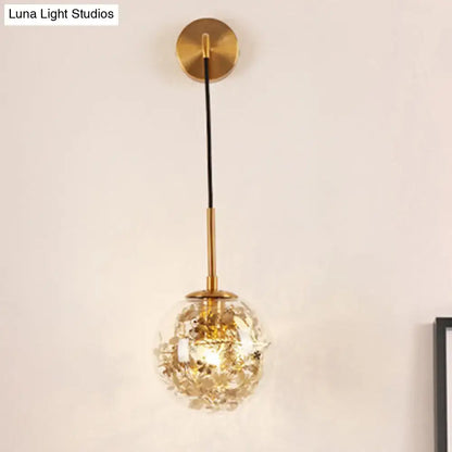 Gold glass orb wall light by Decorbites with brass hardware and clear textured globe on Tampa Home & Garden Store