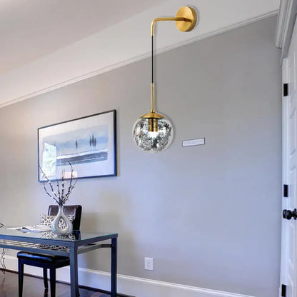 Gold Glass Orb Wall Light Decorbites, brass arm with clear etched glass globe and black cord on Tampa Home & Garden Store