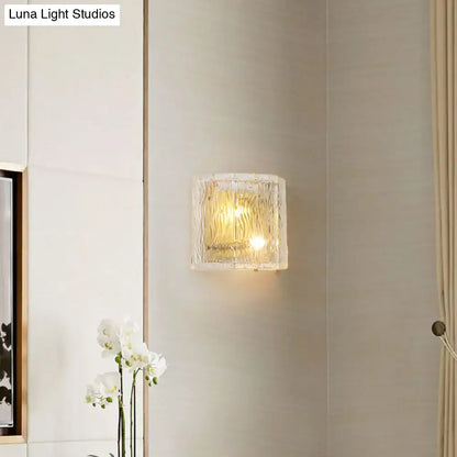 Gold ripple glass sconce with warm yellow glow on pale wall on Tampa Home & Garden Store