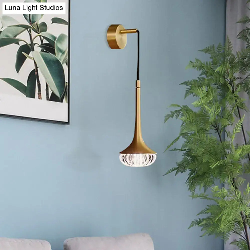 Gold textured glass flared wall sconce with brass stem on blue wall by Decorbites on Tampa Home & Garden Store