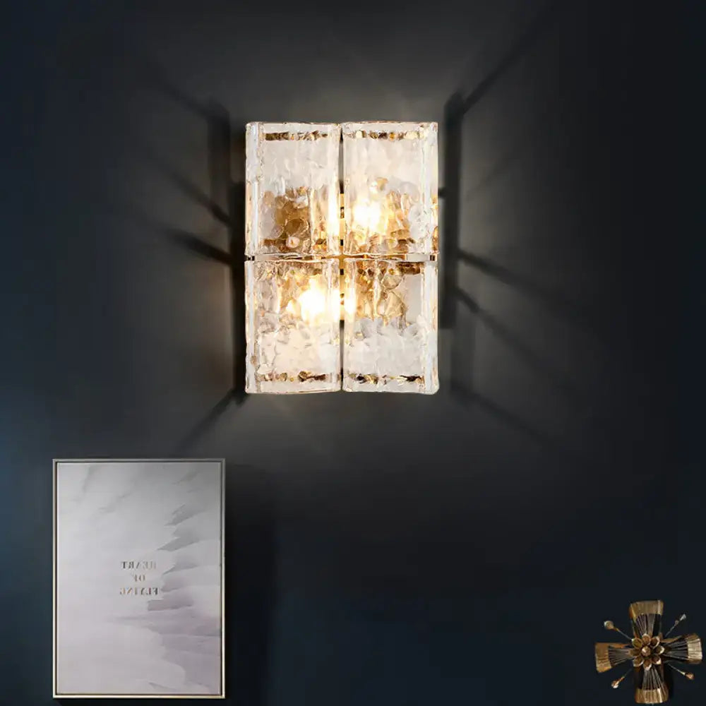 Gold Water Glass Sconce by Decorbites; four crackle glass blocks glow on dark wall on Tampa Home & Garden Store