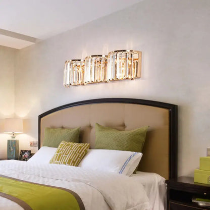 Gold crystal block sconce by Decorbites, sleek contemporary wall lighting above bed on Tampa Home & Garden Store