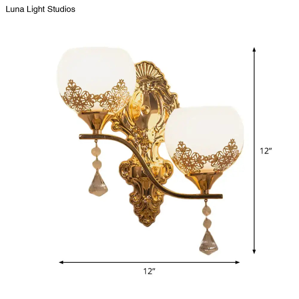Gold lace-cutout wall sconce with two glass shades and crystal drops by Decorbites on Tampa Home & Garden Store