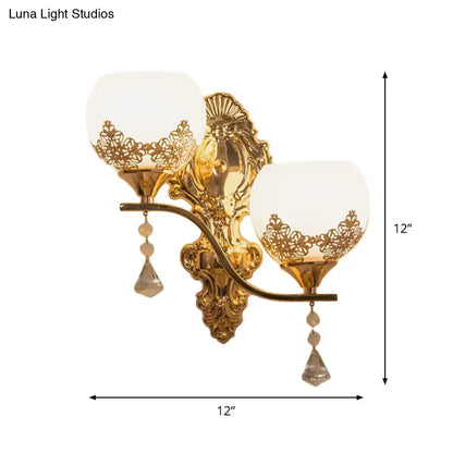 Gold lace-cutout wall sconce with two glass shades and crystal drops by Decorbites on Tampa Home & Garden Store
