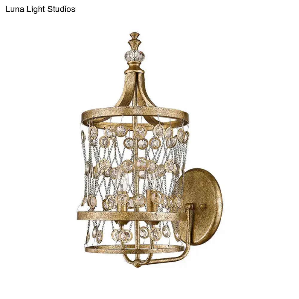 Gold crystal cylinder cage wall light sconce with hanging crystals and gold frame on Tampa Home & Garden Store