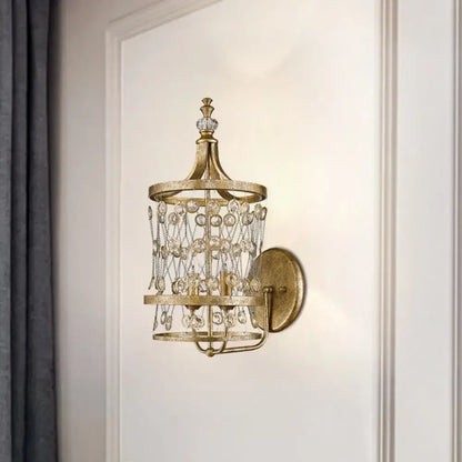 Gold crystal cylinder cage wall light by Decorbites with crystal beads and backplate on Tampa Home & Garden Store