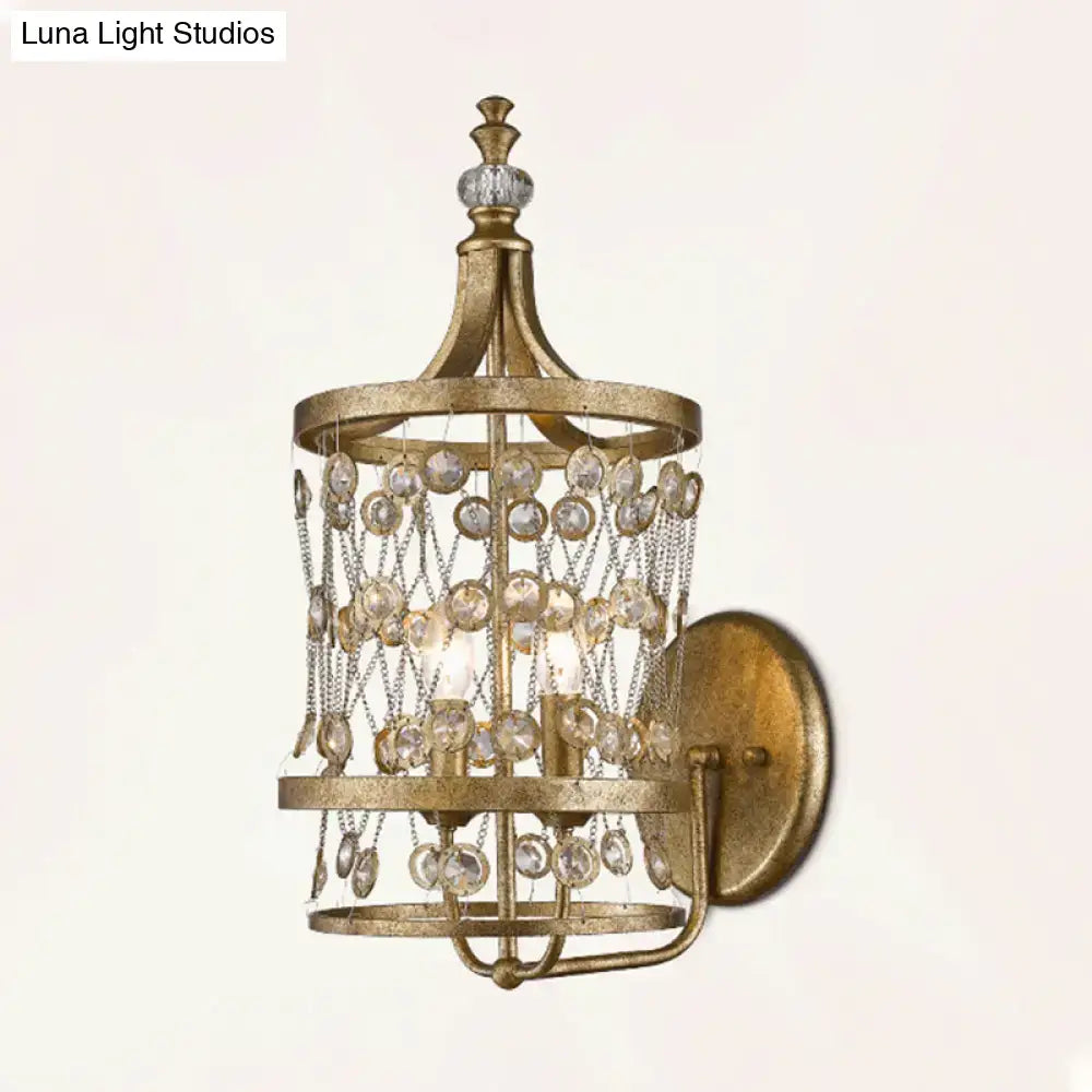 Gold crystal cylinder cage wall light by Decorbites with golden metal frame and hanging prisms on Tampa Home & Garden Store