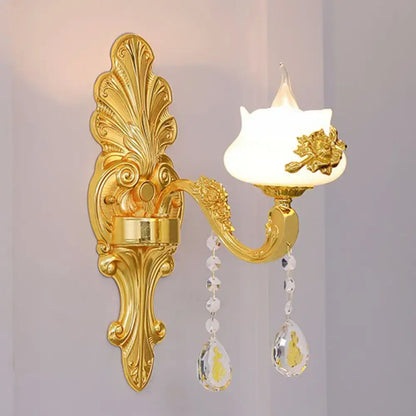 Modern gold crystal droplet wall sconce by Decorbites with ornate backplate and hanging prisms on Tampa Home & Garden Store