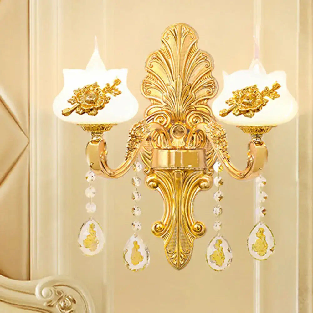 Modern gold crystal droplet wall sconce by Decorbites, with dual arms and backplate on Tampa Home & Garden Store