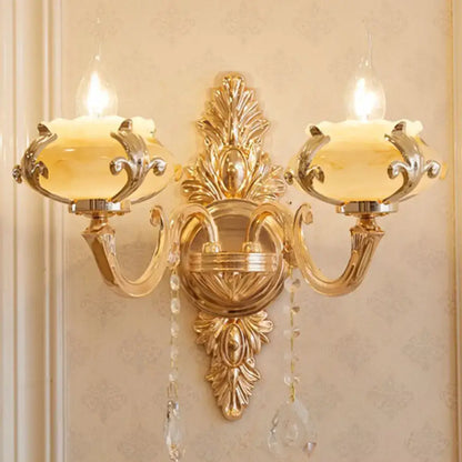 Modern gold crystal droplet two-light wall sconce by Decorbites with ornate backplate on Tampa Home & Garden Store