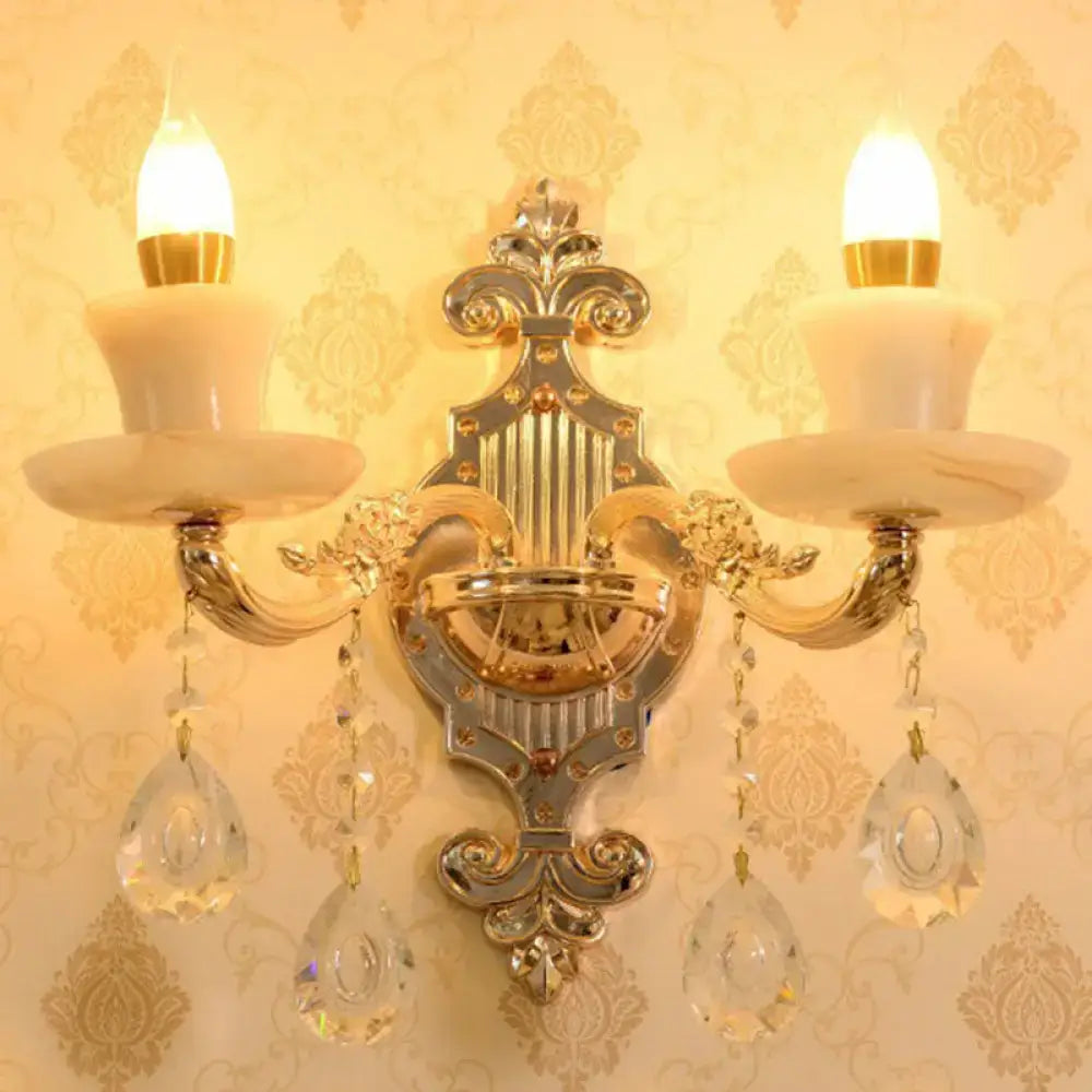 Decorbites modern gold crystal droplet wall sconce with two candle bulbs and crystal drops on Tampa Home & Garden Store