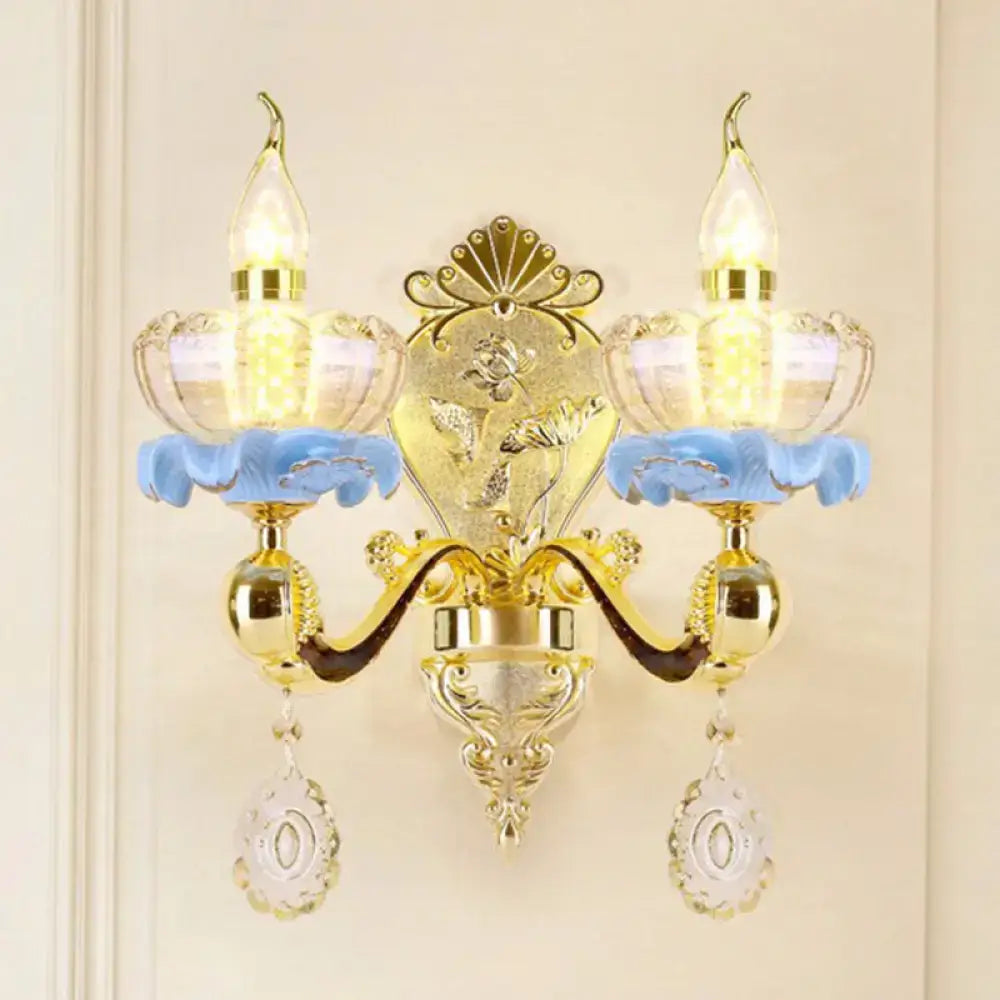 Decorbites modern gold crystal droplet wall sconce with blue glass accents and hanging prisms on Tampa Home & Garden Store
