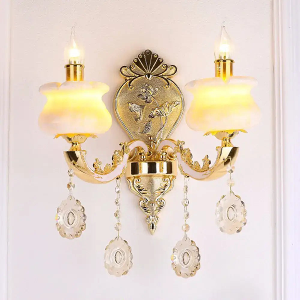 Decorbites gold crystal droplet two-arm wall sconce with hanging prisms on Tampa Home & Garden Store