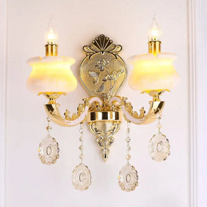 Decorbites gold crystal droplet two-arm wall sconce with hanging prisms on Tampa Home & Garden Store