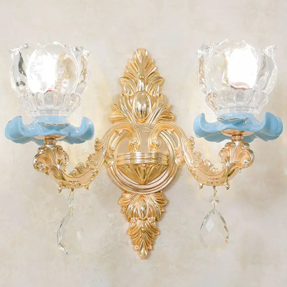 Modern gold crystal droplet wall sconce by Decorbites with dual arms and blue glass accents on Tampa Home & Garden Store
