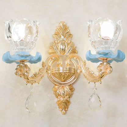 Modern gold crystal droplet wall sconce by Decorbites with dual arms and blue glass accents on Tampa Home & Garden Store