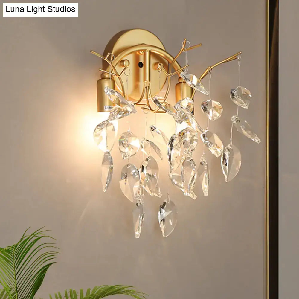 Gold crystal leaf branch wall sconce by Decorbites with hanging prisms and warm glow on Tampa Home & Garden Store