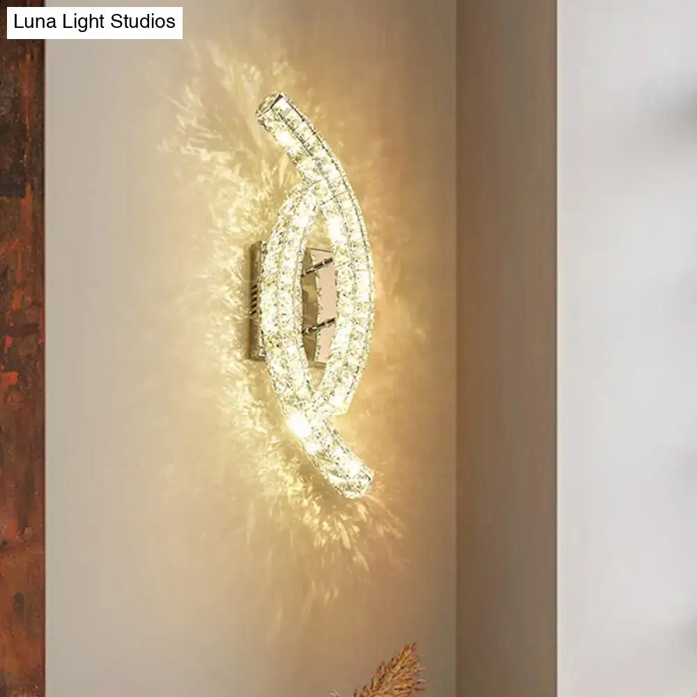 Gold crystal leaf sconce by Decorbites, wall-mounted curved double-arc with crystals, warm light on Tampa Home & Garden Store
