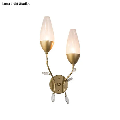 Gold brass two-light sconce with leaf design frosted glass shades by Decorbites on Tampa Home & Garden Store