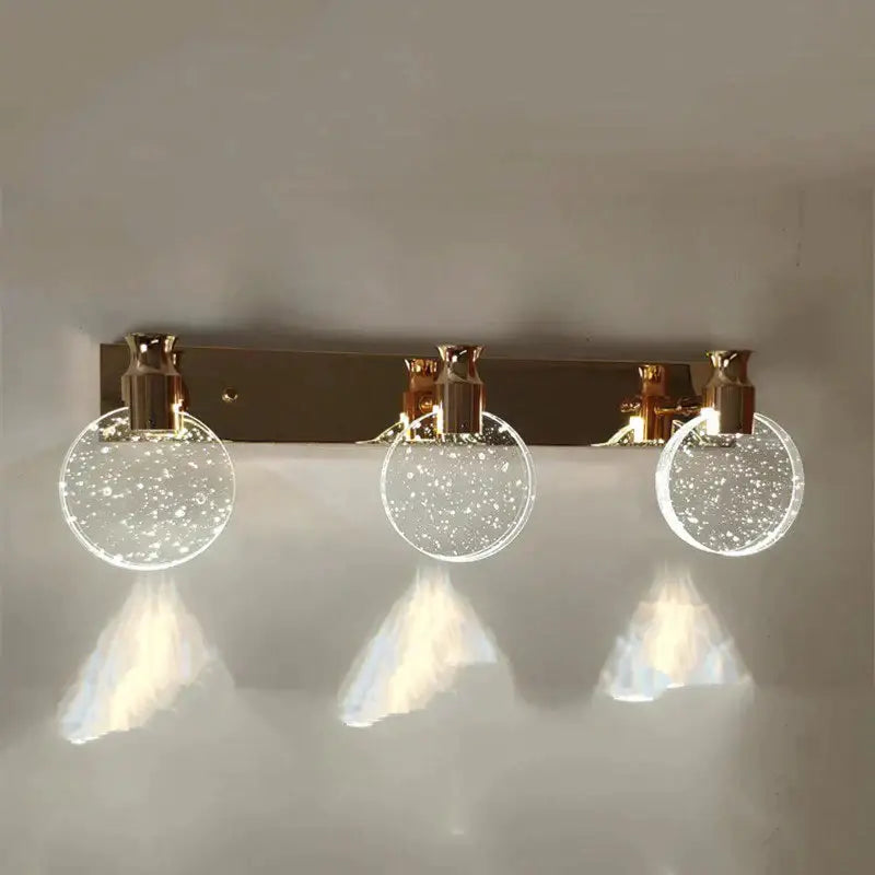 Gold Three Globe Wall Light with three glass globes in a gold finish on Tampa Home & Garden Store