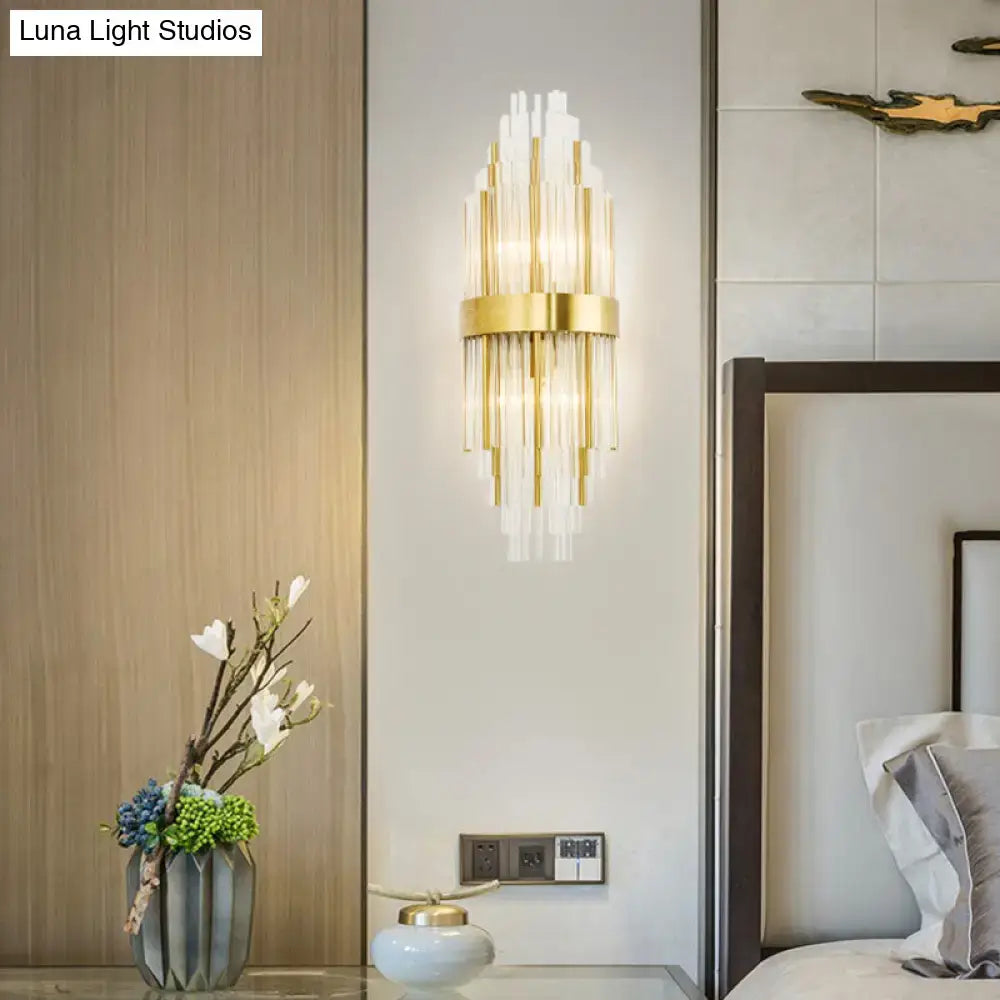 Decorbites gold cascading glass sconce with brass band and glass rods on wall on Tampa Home & Garden Store