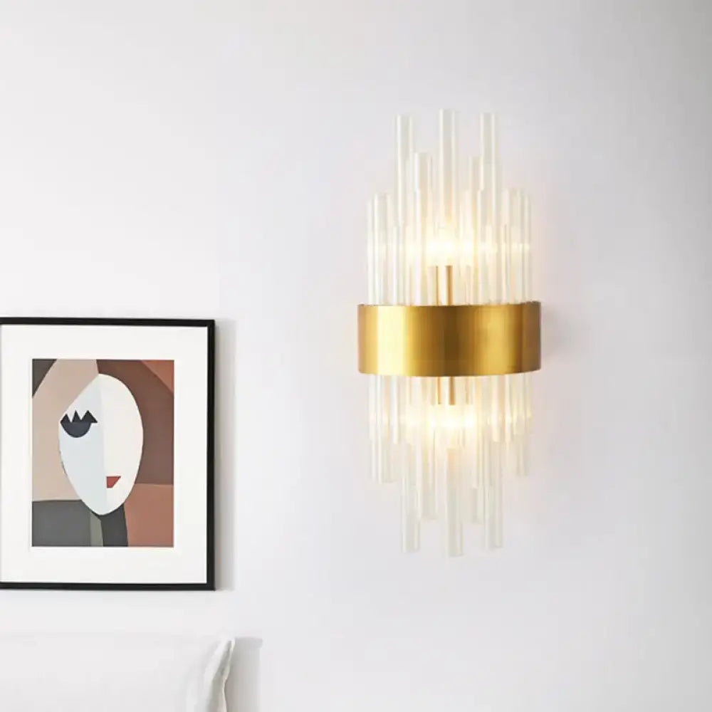 Gold Crystal 2-Light Wall Sconce by Decorbites with a gold band and crystal prisms on white wall on Tampa Home & Garden Store