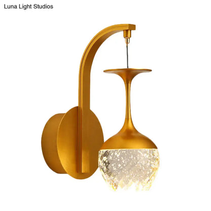 Gold crystal dimmable bedroom sconce with curved gold arm and crystal shade by Decorbites on Tampa Home & Garden Store