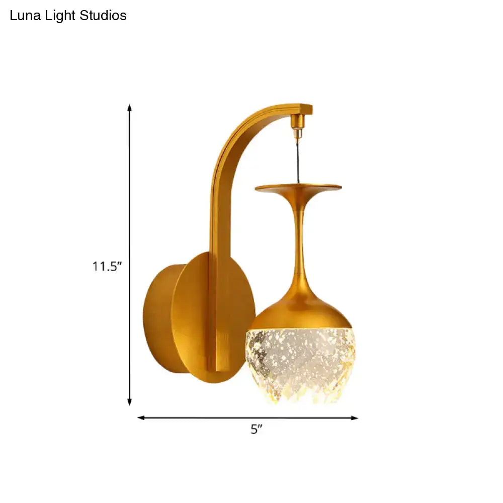 Gold crystal dimmable bedroom sconce with curved brass arm and crystal shade by Decorbites on Tampa Home & Garden Store