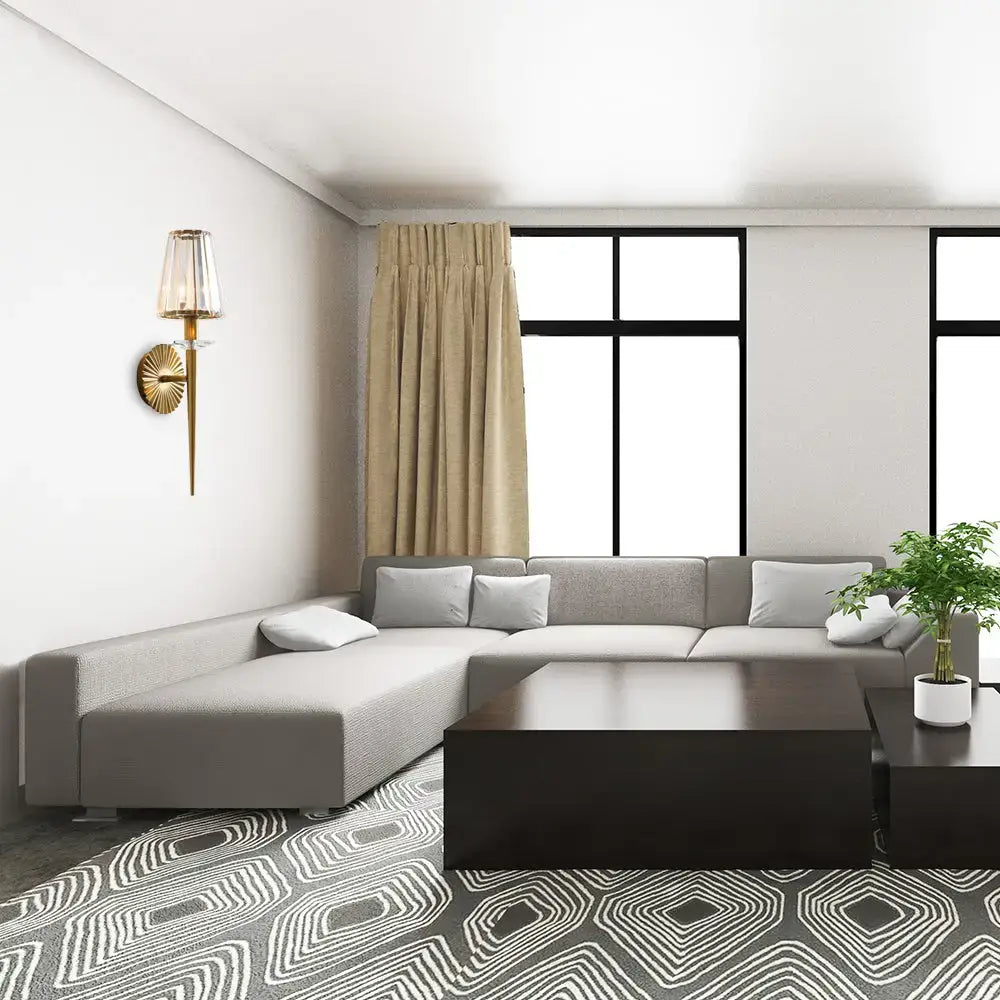 Decorbites gold crystal sunburst wall light on white wall in a modern living room on Tampa Home & Garden Store