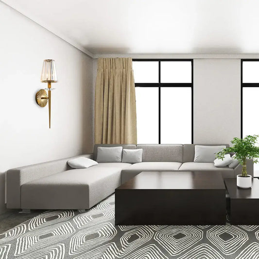Decorbites gold crystal sunburst wall light on white wall in a modern living room on Tampa Home & Garden Store