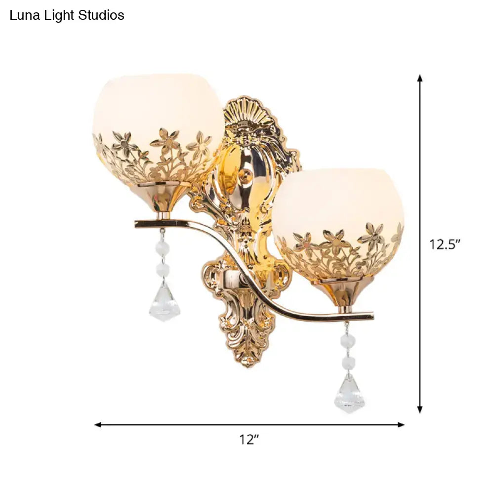 Decorbites gold crystal two-head wall sconce with ornate backplate and hanging drops on Tampa Home & Garden Store