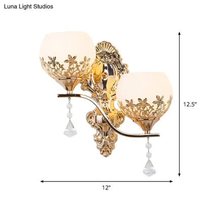 Decorbites gold crystal two-head wall sconce with ornate backplate and hanging drops on Tampa Home & Garden Store