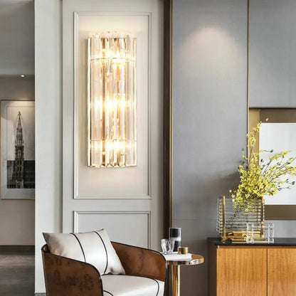 Gold crystal dining area wall sconce by Decorbites with vertical prisms and warm glow on Tampa Home & Garden Store