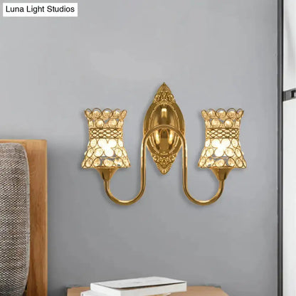 Modern gold crystal swirl wall sconce by Decorbites with dual lights and ornate backplate on Tampa Home & Garden Store