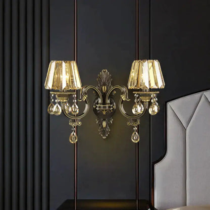 Modern gold crystal teardrop wall sconce set with dual arms and hanging crystals on Tampa Home & Garden Store