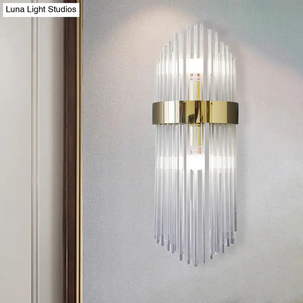 Gold layered crystal LED wall sconce by Decorbites, clear crystal prisms with a gold band on Tampa Home & Garden Store